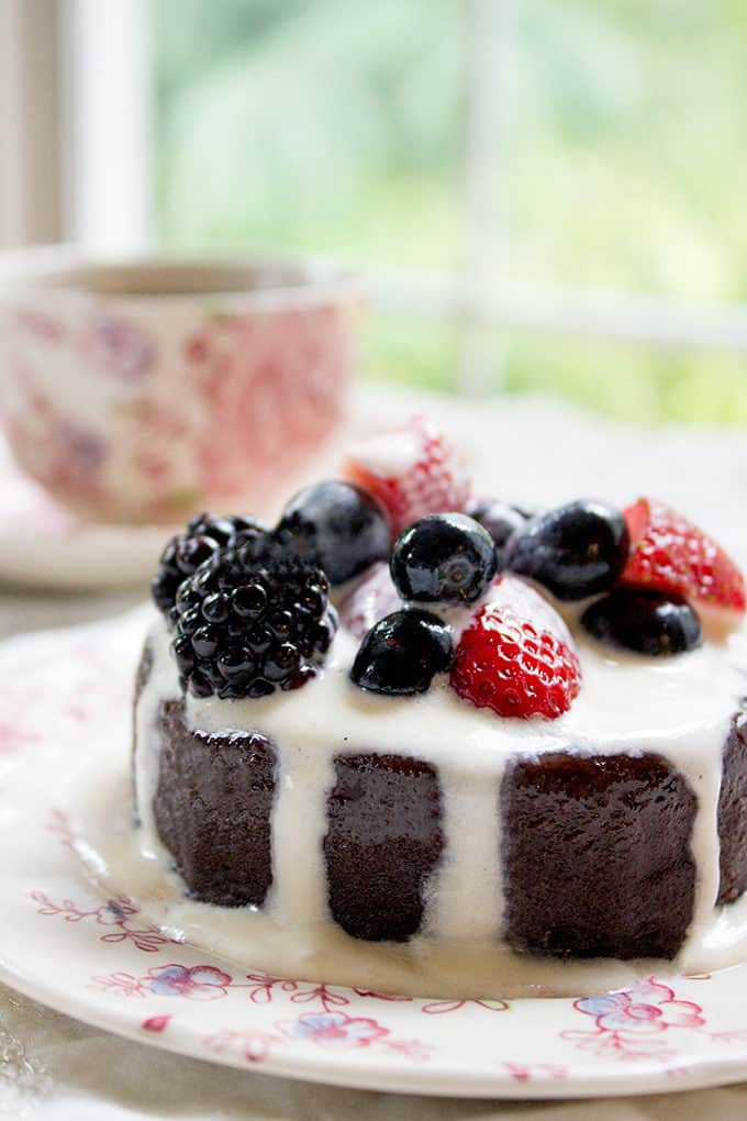Flourless Mocha Cake with Creme Anglaise on plate with fresh berries