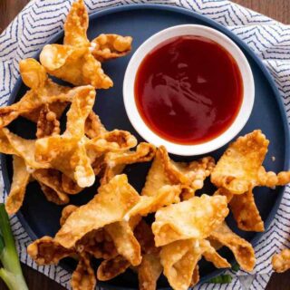 dCream Cheese Rangoon on serving plate with dipping sauce