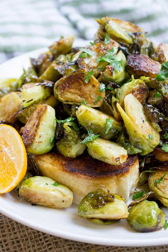 Tin Roof Bistro Brussels Sprouts are caramelized and tossed in a lemony caper butter sauce. The most popular item on the menu will make anyone a fan!