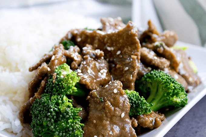 Broccoli and beef served with white rice