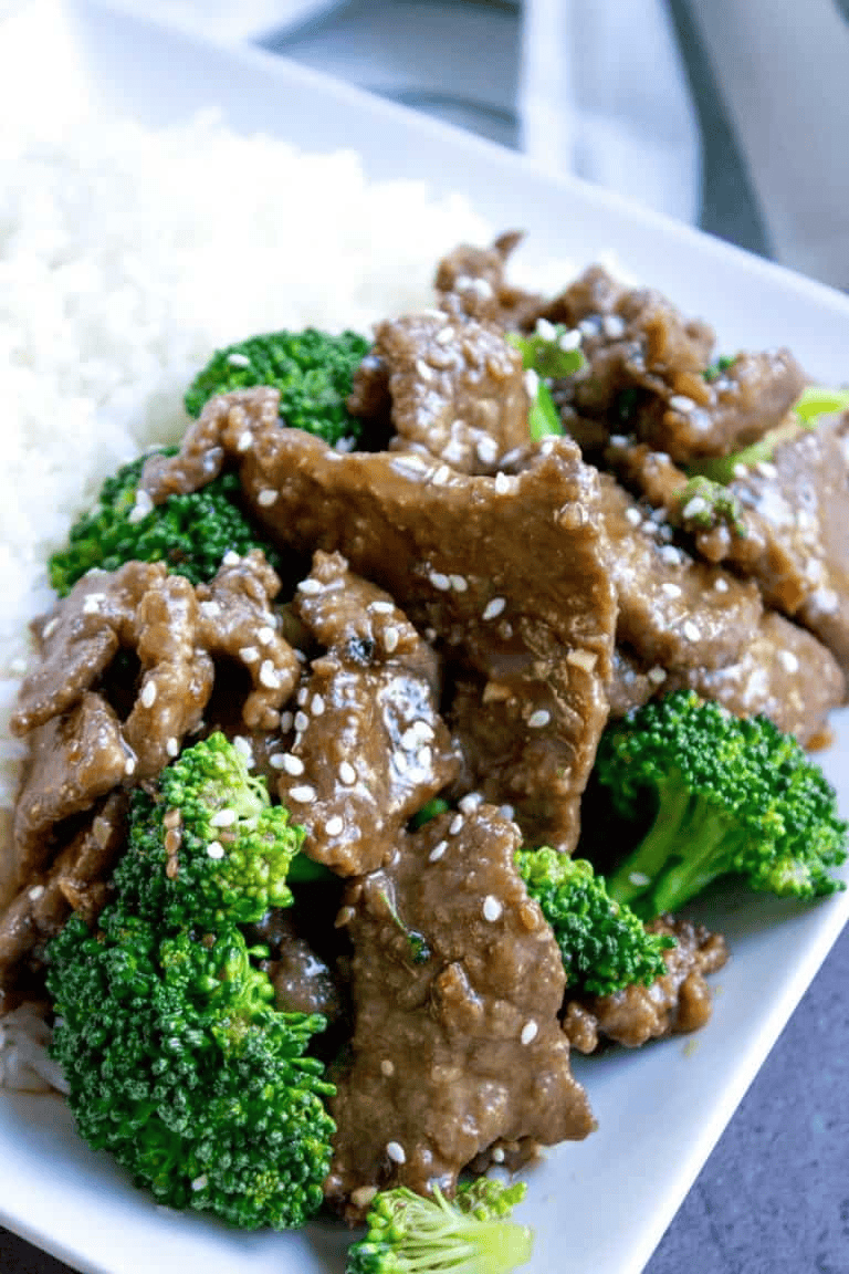 Beef and broccoli topped with white sesame seeds