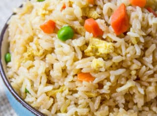 Classic Fried Rice takes just ten minutes to make with day old steamed rice, soy sauce, eggs and oyster sauce. You can add your favorite vegetables and proteins to taste.