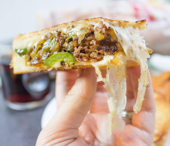 Ground Philly Cheesesteak Grilled Cheese made with bell peppers, onions and American or Provolone Cheese. All the flavor of a cheese steak for half the price.