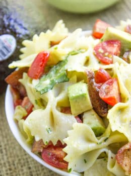 Avocado BLT Pasta Salad with avocados blended into a cilantro lime dressing and chunks for a delicious creamy bite with bacon, lettuce and tomatoes.