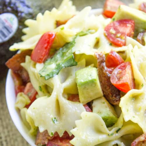 Avocado BLT Pasta Salad with avocados blended into a cilantro lime dressing and chunks for a delicious creamy bite with bacon, lettuce and tomatoes.