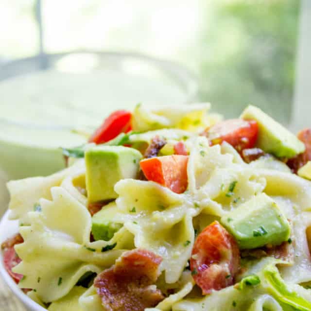 Avocado BLT Pasta Salad with avocados blended into a cilantro lime dressing and chunks for a delicious creamy bite with bacon, lettuce and tomatoes.
