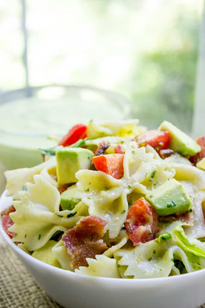 Avocado BLT Pasta Salad with avocados blended into a cilantro lime dressing and chunks for a delicious creamy bite with bacon, lettuce and tomatoes.