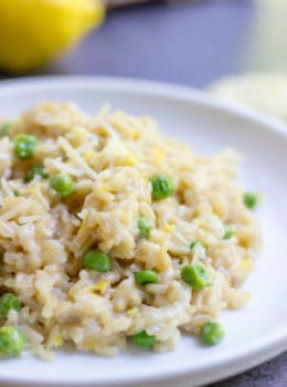 One Minute Brown Rice Risotto with garlic, peas and lemon makes the perfect on the go meal that feels like you spent all day in the kitchen in just one minute in the microwave.