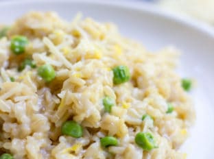 One Minute Brown Rice Risotto with garlic, peas and lemon makes the perfect on the go meal that feels like you spent all day in the kitchen in just one minute in the microwave.