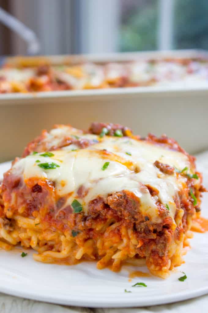 Baked Million Dollar Spaghetti is creamy with a melty cheese center, topped with meat sauce and extra bubbly cheese. Tastes like a cross between baked ziti and lasagna with half the effort!