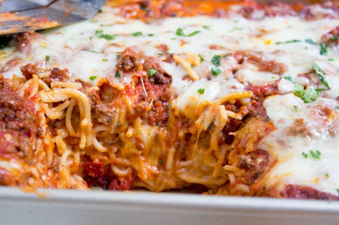 Baked Million Dollar Spaghetti is creamy with a melty cheese center, topped with meat sauce and extra bubbly cheese. Tastes like a cross between baked ziti and lasagna with half the effort!