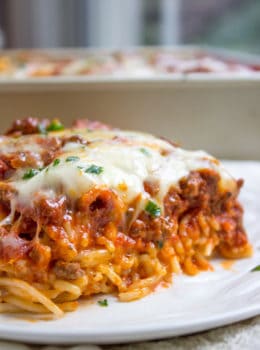 Baked Million Dollar Spaghetti is creamy with a melty cheese center, topped with meat sauce and extra bubbly cheese. Tastes like a cross between baked ziti and lasagna with half the effort!