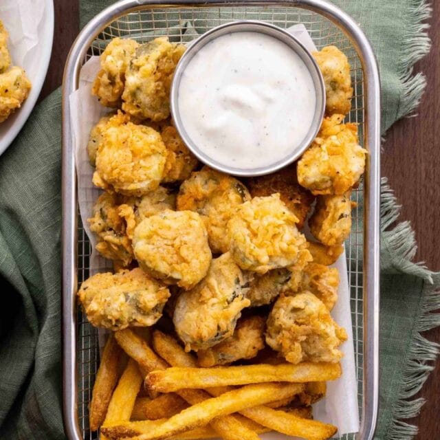 Fried Pickles in basket with ranch sauce
