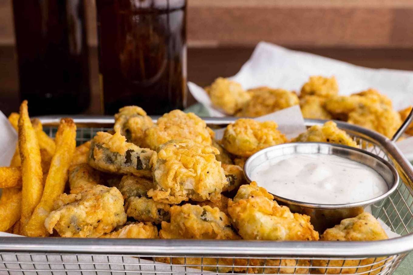 Fried Pickles in basket with ranch sauce