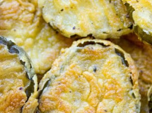 Fried Pickles made with sliced dill pickles breaded in seasoned flour and fried crispy are a fun side dish to add to your bbq plate and take just a few minutes to make.