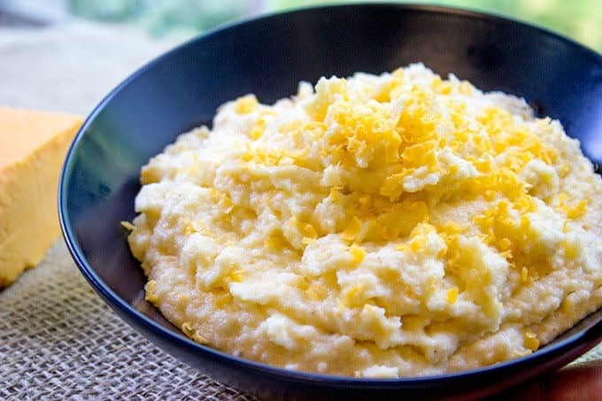 Oven Baked Creamy Cheese Polenta made with just four ingredients and none of the danger associated with boiling, bubbling hot polenta on the stove you have to keep stirring!