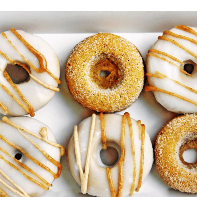 Half dozen donuts in box.