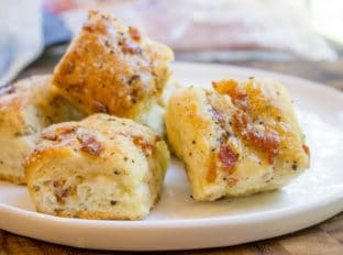 Black Pepper Bacon Biscuits are peppery, full of delicious bacon, cream cheese and buttermilk, they are fluffy and flaky. The perfect biscuit for your weekend brunch!