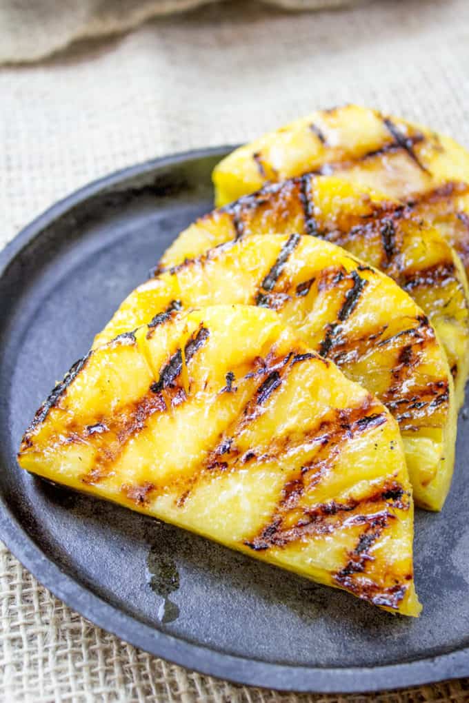 How to Grill Pineapple - grilled pineapple slices on plate