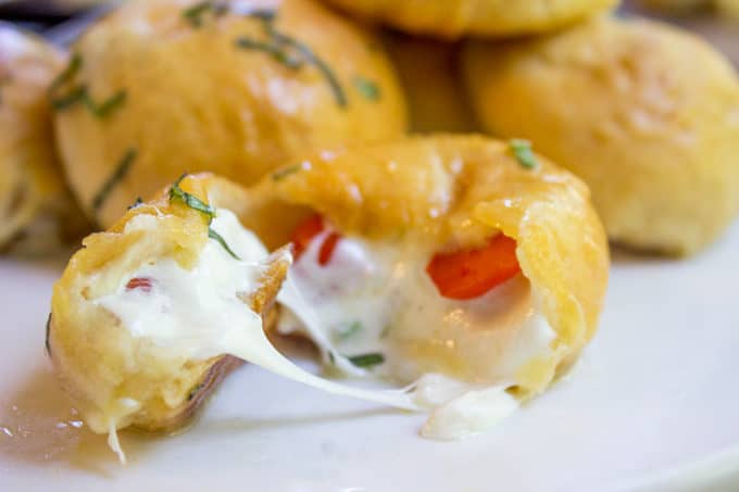 Caprese Pizza Bombs are a quick, fun treat or appetizer with fresh mozzarella, basil and cherry tomatoes. Plus the stretchy cheese factor is amazing.