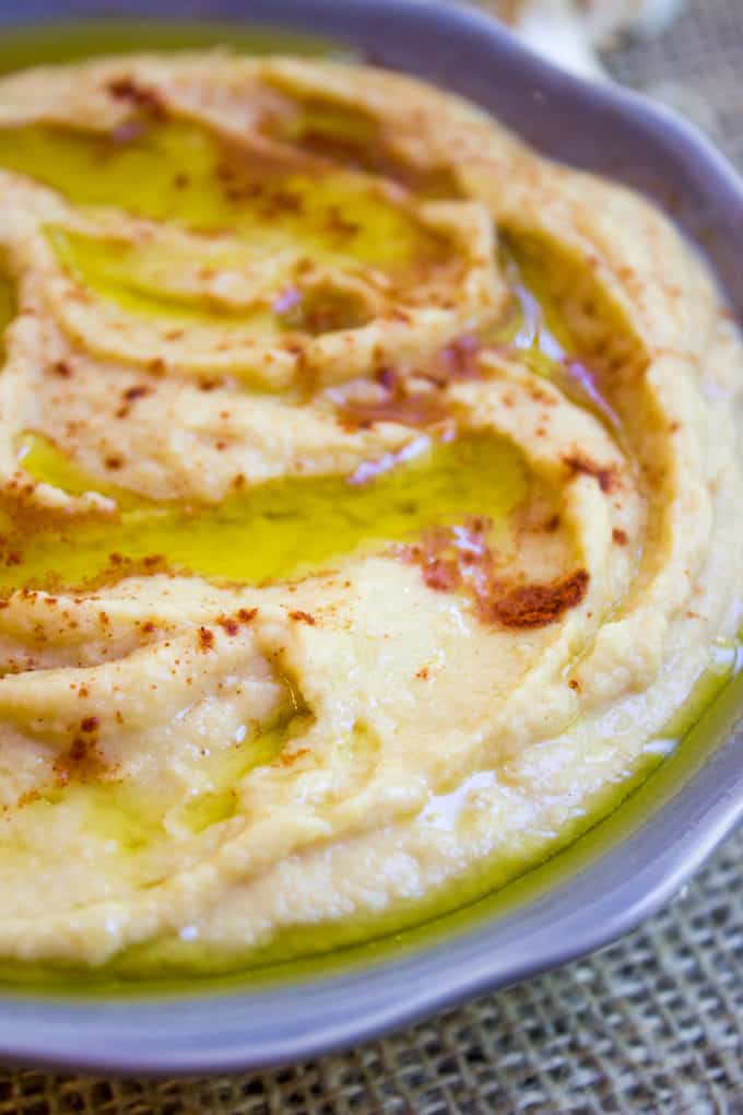 Bowl of fresh homemade hummus made from classic hummus ingredients