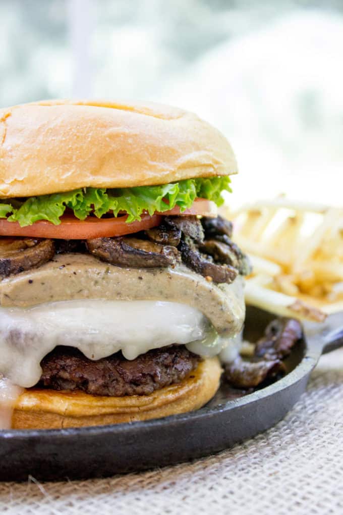 Truffle Mousse Burgers made at home with delicious truffle mousse, mushrooms and pepper crusted beef patties, this is the perfect indulgent burger for your summer cookout, graduation or Father's Day.