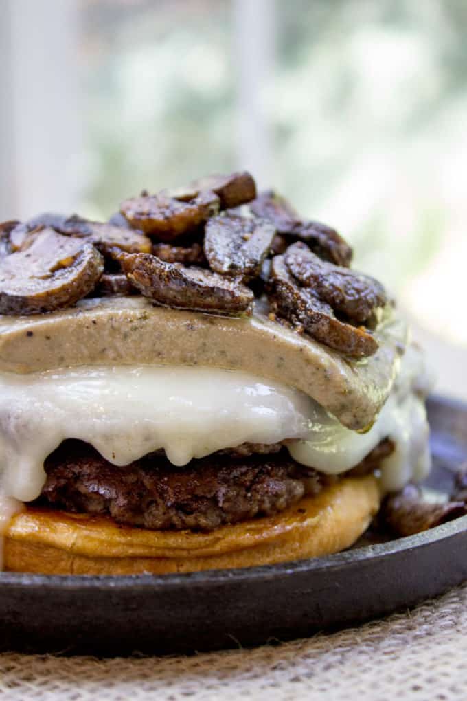 Truffle Mousse Burgers made at home with delicious truffle mousse, mushrooms and pepper crusted beef patties, this is the perfect indulgent burger for your summer cookout, graduation or Father's Day.