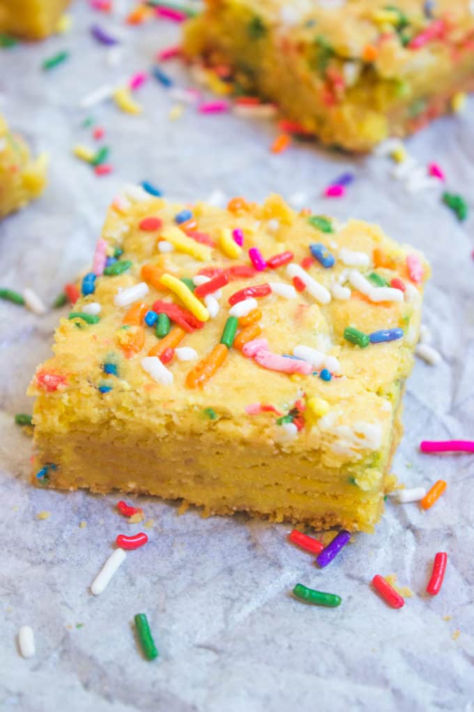 Cake Batter Blondies with all the flavors of your favorite birthday cake without the cake mix! Full of sprinkle goodness, chewy and soft!