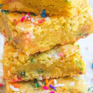 Cake Batter Blondies with all the flavors of your favorite birthday cake without the cake mix! Full of sprinkle goodness, chewy and soft!