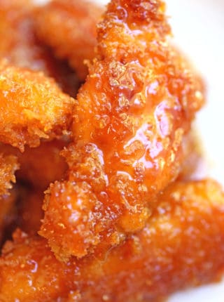 Chicken Fire Poppers are panko crusted, skillet fried then dipped in the most glorious honey-brown sugar hot sauce you've ever tasted and baked until they are bites of crunchy, sticky, sweet, spicy perfection!