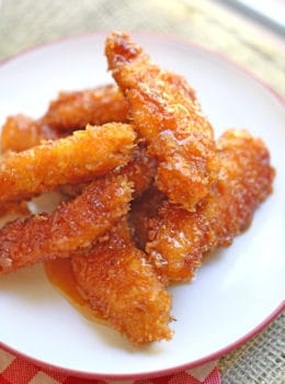 Chicken Fire Poppers are panko crusted, skillet fried then dipped in the most glorious honey-brown sugar hot sauce you've ever tasted and baked until they are bites of crunchy, sticky, sweet, spicy perfection!