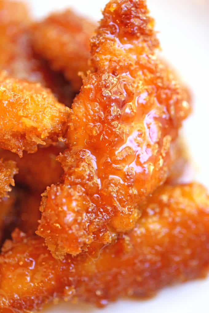 Chicken Fire Poppers are panko crusted, skillet fried then dipped in the most glorious honey-brown sugar hot sauce you've ever tasted and baked until they are bites of crunchy, sticky, sweet, spicy perfection!