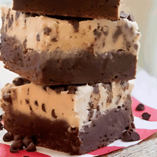 Cookie brownies stacked on napkin on table