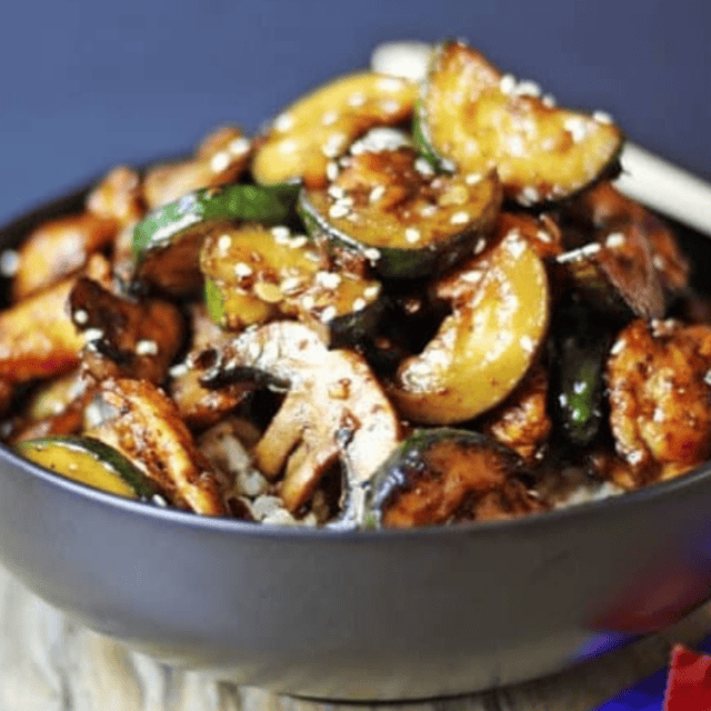 Mushroom and zucchini served in bowl with chicken