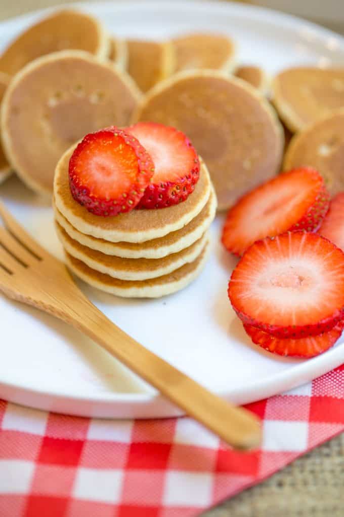 Mini Pancakes, sometimes called Silver Dollar are the easiest quickest little pancake bites that are perfect for parties, brunches, kids and pancake kabobs! dinnerthendessert.com