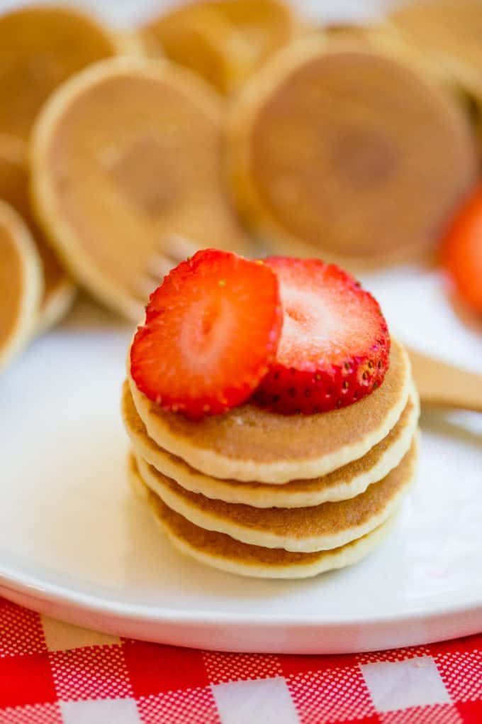 Mini Pancakes, sometimes called Silver Dollar are the easiest quickest little pancake bites that are perfect for parties, brunches, kids and pancake kabobs! dinnerthendessert.com