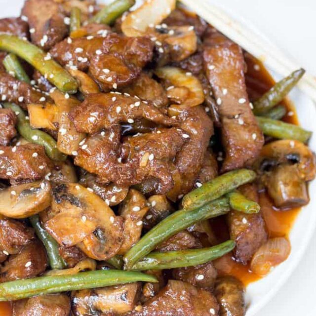 steak stir fry in a white bowl 1x1