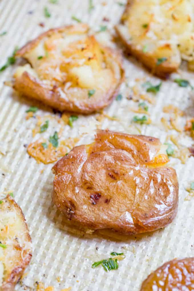 Parmesan Garlic Crash Hot Potatoes are crispy, creamy, cheesy and garlicky. Made in one pan and no boiling necessary, they're the perfect holiday side dish.