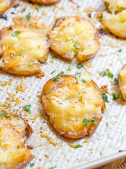 Parmesan Garlic Crash Hot Potatoes are crispy, creamy, cheesy and garlicky. Made in one pan, there is no boiling necessary and they make the perfect holiday side dish.