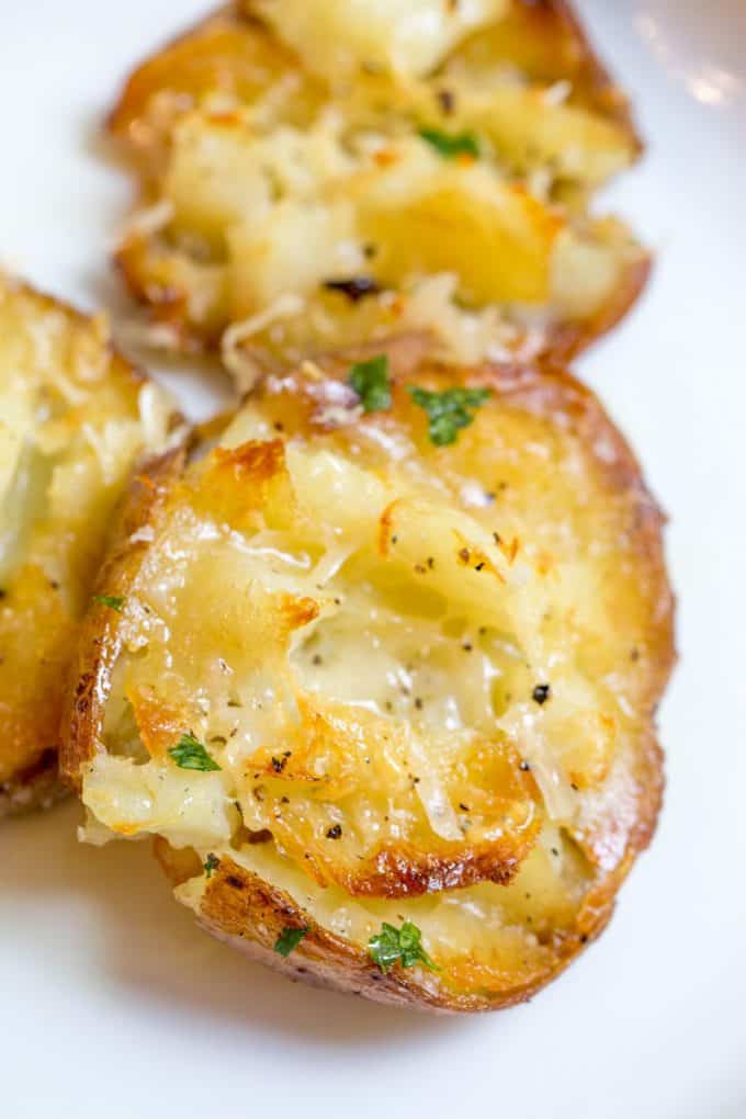 Parmesan Garlic Crash Hot Potatoes are crispy, creamy, cheesy and garlicky. Made in one pan and no boiling necessary, they're the perfect holiday side dish.