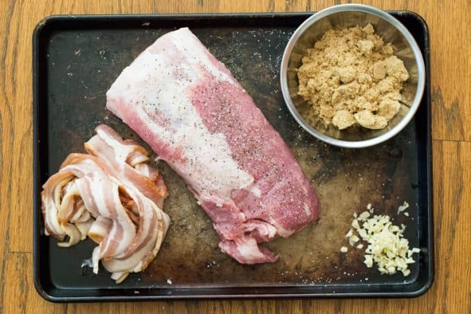 Ingredients for slow cooker pork loin laid out on baking sheet
