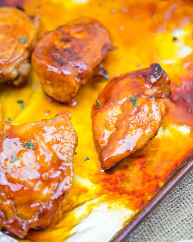 Baked Fire Popper Chicken is made with chicken breasts baked in a glorious honey-brown sugar hot sauce until they're sticky, sweet, spicy perfection!