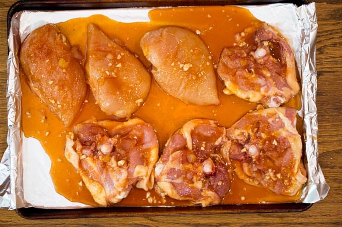chicken before cooking on a sheet pan 