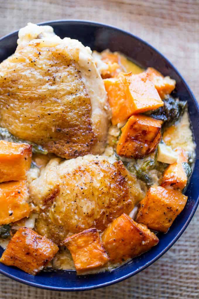 Creamy Garlic Parmesan Roasted Chicken and Sweet Potatoes and Spinach made in one pan and in less than 45 minutes so you can enjoy it during the week as the weather cools down.