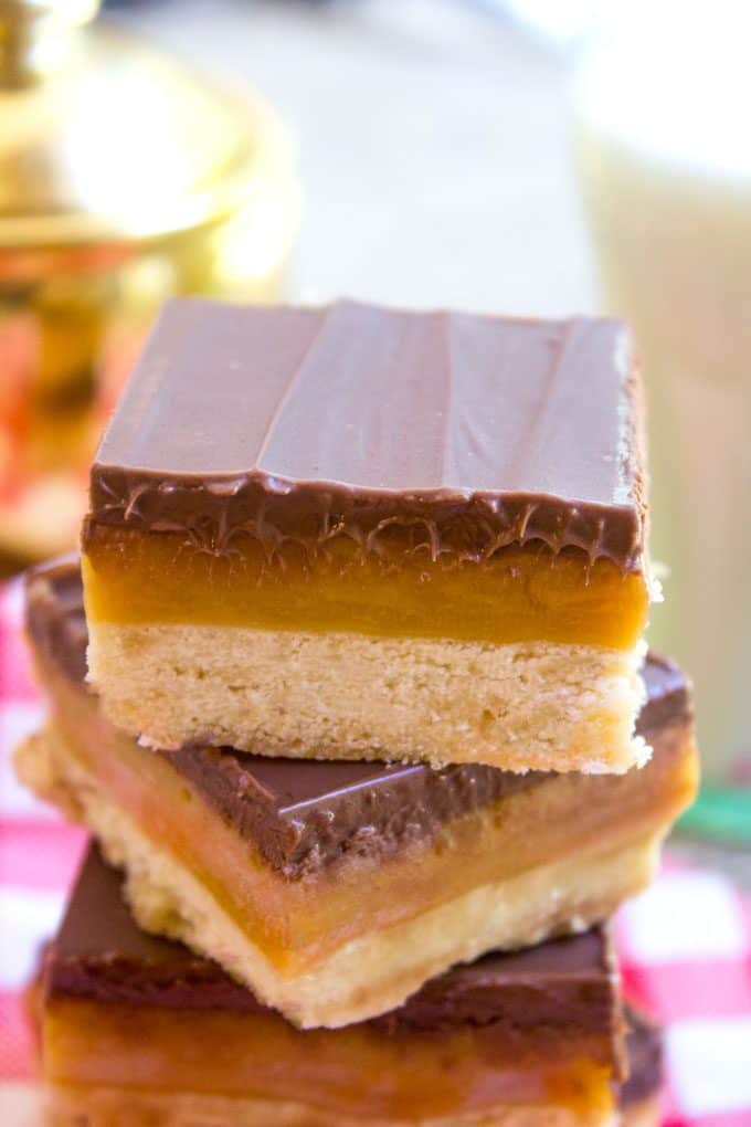 Homemade Twix Bars with a classic shortbread crust, gooey caramel filling and a sweet milk chocolate topping. A perfect homemade candy bar copycat.