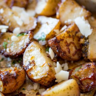 Parmesan Pesto Roasted Potatoes are ready for roasting in minutes with red potatoes, basil pesto, olive oil and Parmesan Cheese.