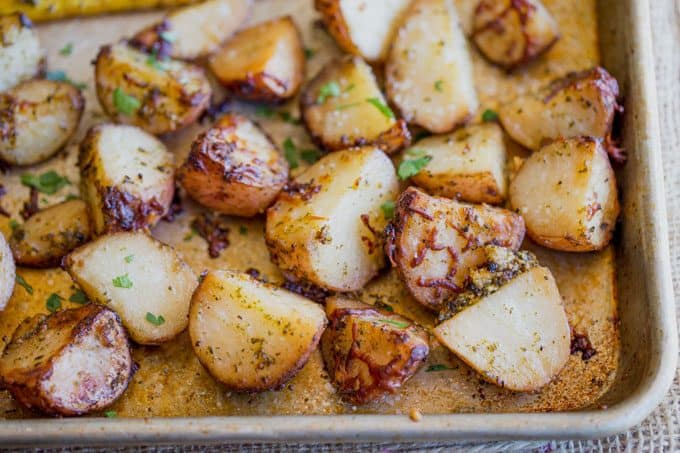 Parmesan Pesto Roasted Potatoes are ready for roasting in minutes with red potatoes, basil pesto, olive oil and Parmesan Cheese.