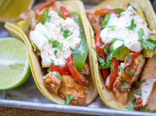 Slow Cooker Chicken Fajitas are made with homemade fajita seasoning mix, chicken, onions, bell peppers and fresh limes for the perfect easy weeknight meal.