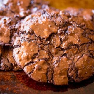 Pile of chocolate cookies on a baking sheet 4x3