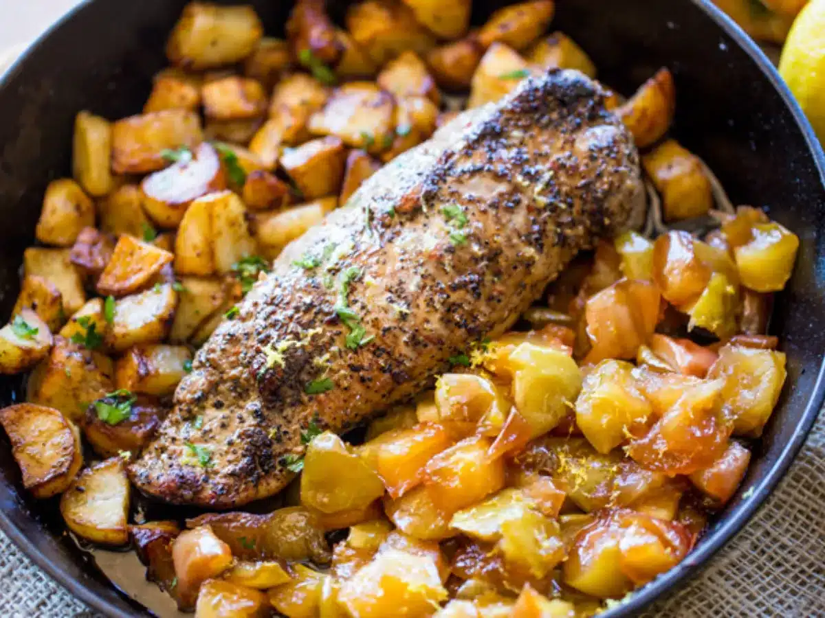Cooked meat with fruit and vegetable in a pan